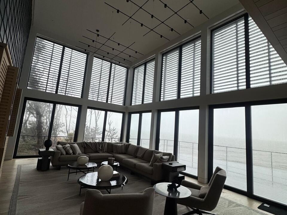 Great room with a tall corner window wall