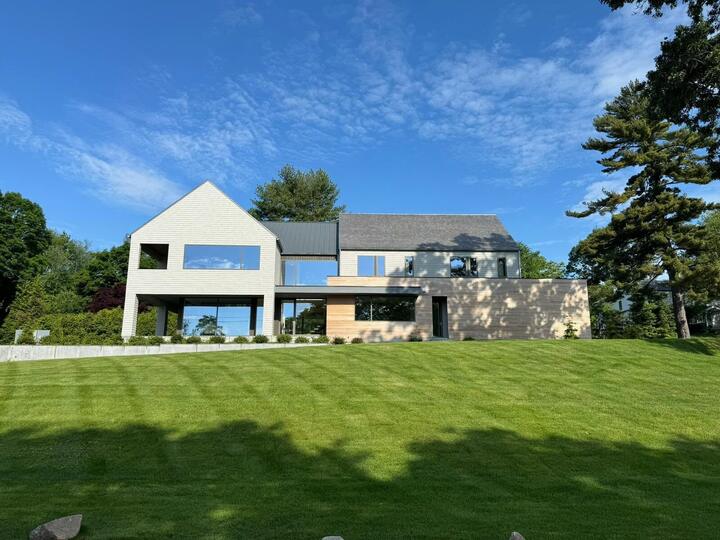 Light modern home with large window openings