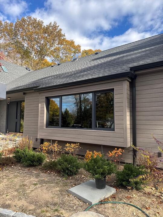 Picture window on tan siding